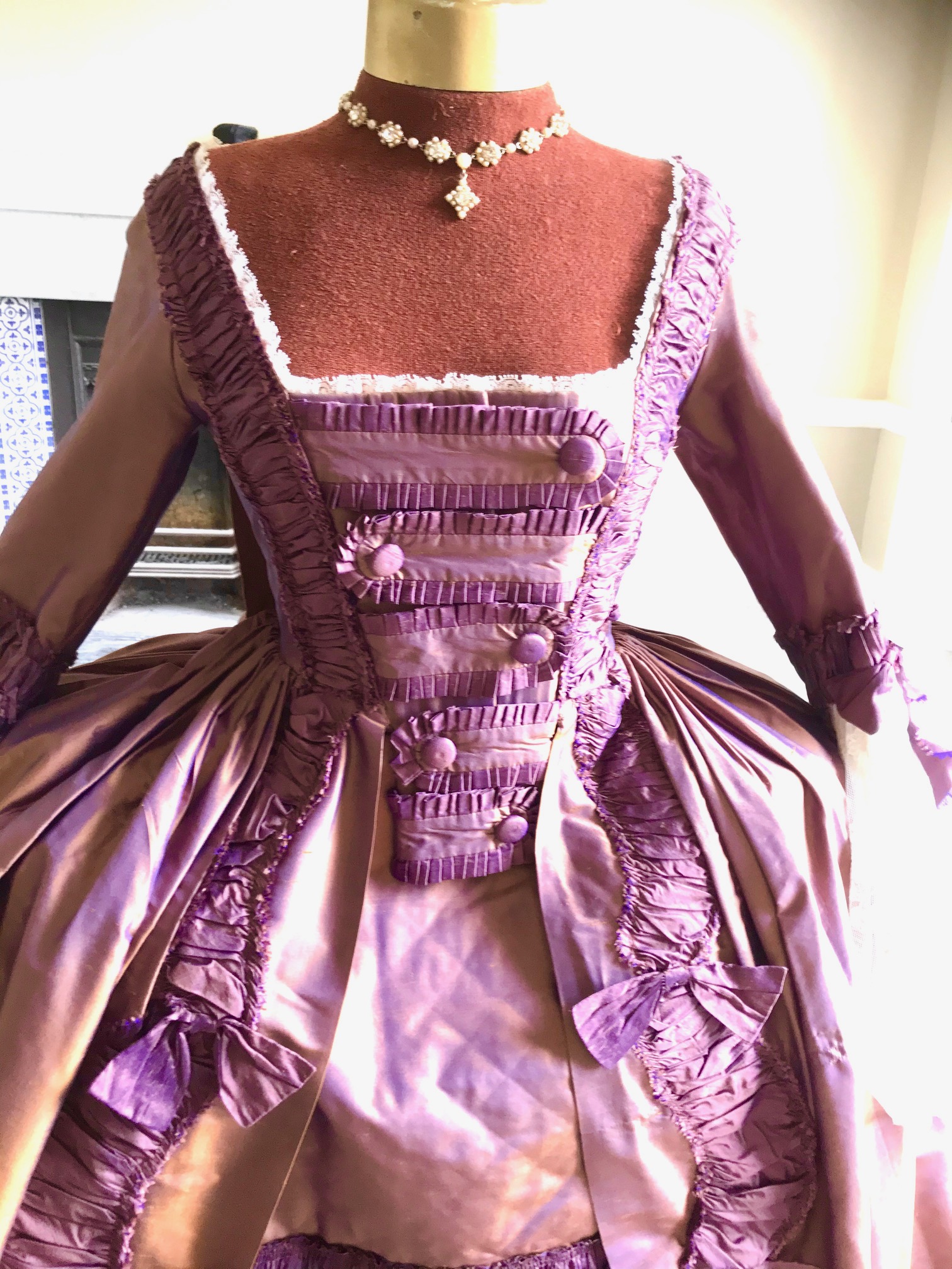 An exceptional lady's 18th century style sack dress, bronze and purple with fine lace cuffs - with skirt and pannier frame. Ex London Festival Opera 'The Magic Flute'.